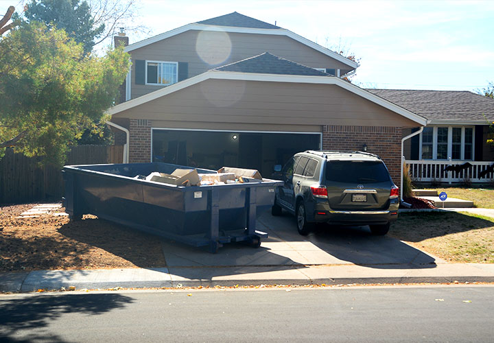 Residential roll-off dumpster beside a suburban American home